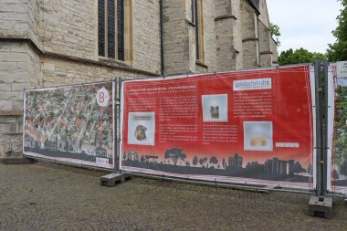 Construction fence banner at the church square