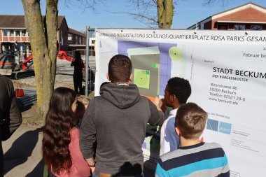 Interested pupils with their teacher at the plan